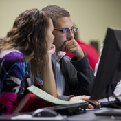 two students working together on a computer